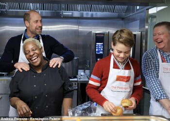 The Prince of Wales and Prince George in the kitchen of The Passage with Head Chef Claudette (front, left) and CEO of The Passage Mick Clarke (far right)