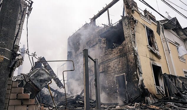Natowas forced to scramble fighter jets as Vladimir Putin unleashed a missile and drone barrage on Ukrainejust hours before Zelenskywas due to meet Trumpin Floridafor talks on a US-brokered peace plan. Pictured: A private residential building in the Darnytskyi district of Kyiv