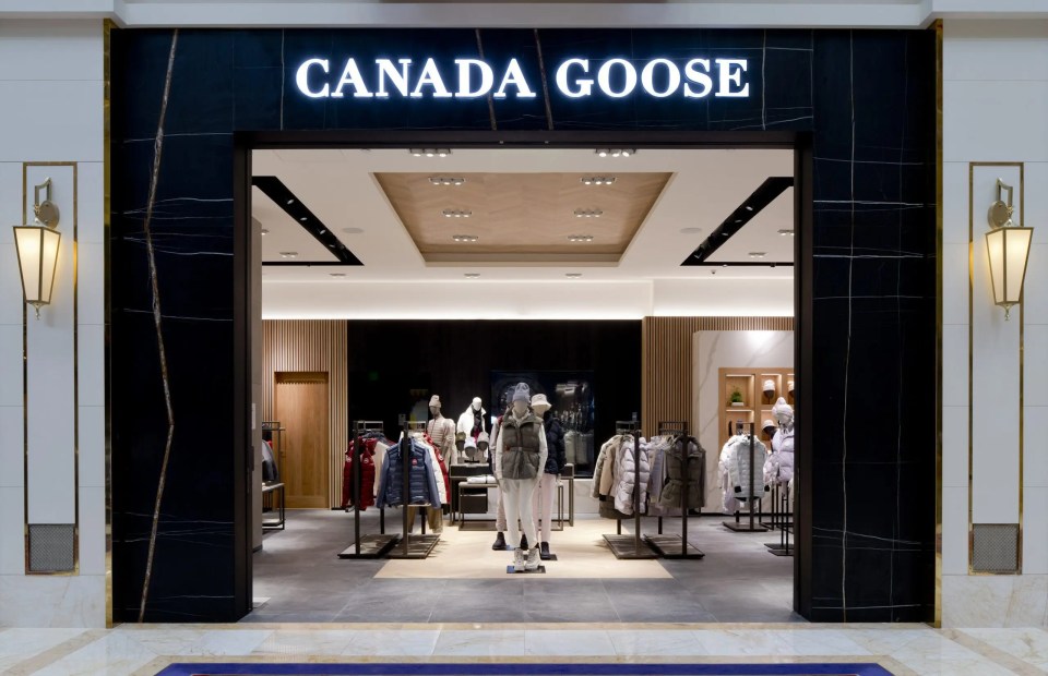 a canada goose store with mannequins in front of it