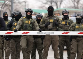 U.S. Border Patrol agents stand guard at the Bishop Henry Whipple Federal Building in Minneapolis, Minnesota, on Jan. 8, 2026.
