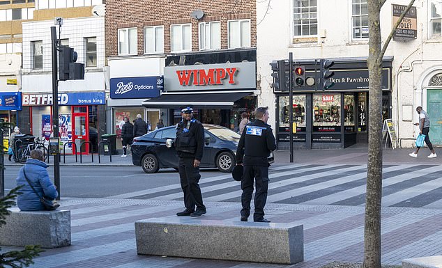 Police community support officers are seen patrolling the High Street to crackdown on anti-social behaviour