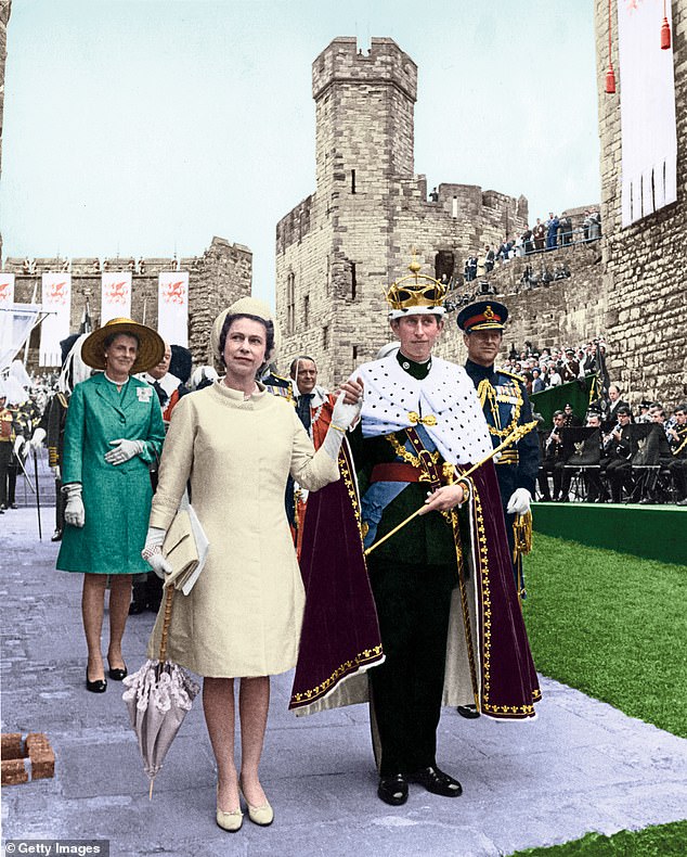 Jones carried the cross and sang at the investiture ceremony for Charles as the Prince of Wales at Caernarfon Castle in 1969 (Charles is pictured that day with Queen Elizabeth II)