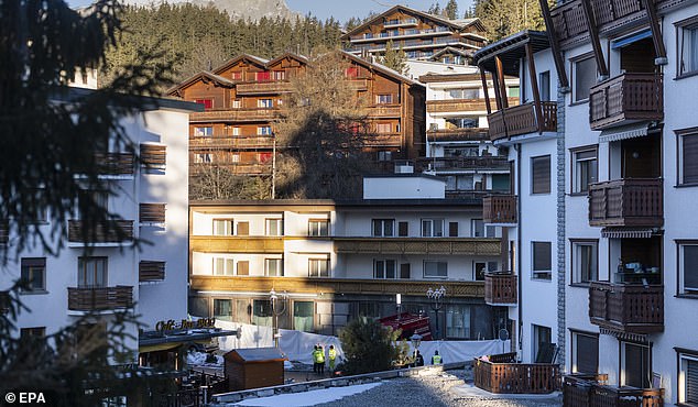 epa12620168 Police officers stand near the site where a fire broke out at Le Constellation bar and lounge following an explosion in the early hours of New Year's Eve, in Crans-Montana, Switzerland, 01 January 2026. According to regional media, the incident caused several deaths and injuries, while the exact cause of the blaze was not immediately known, Swiss cantonal police said.  EPA/ALESSANDRO DELLA VALLE