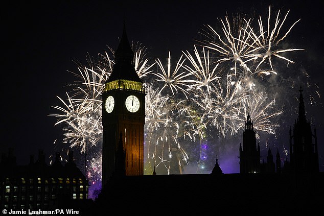 Fireworks light up the sky over the Elizabeth Tower and the London Eye in London last night