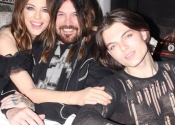 Elizabeth Hurley, 60, and her boyfriend Billy Ray Cyrus, 64, looked more loved-up than ever as they rang in the New Year with her son Damian in loved-up snaps on Tuesday