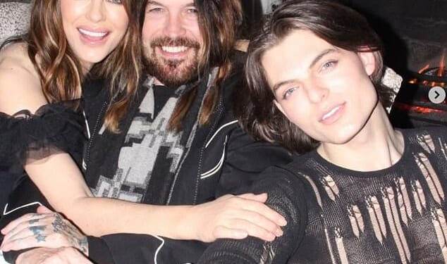 Elizabeth Hurley, 60, and her boyfriend Billy Ray Cyrus, 64, looked more loved-up than ever as they rang in the New Year with her son Damian in loved-up snaps on Tuesday