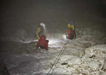 Two hikers were rescued off Britain's second highest mountain in minus 15C temperatures wearing just jogging bottoms and trainers
