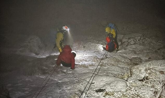 Two hikers were rescued off Britain's second highest mountain in minus 15C temperatures wearing just jogging bottoms and trainers