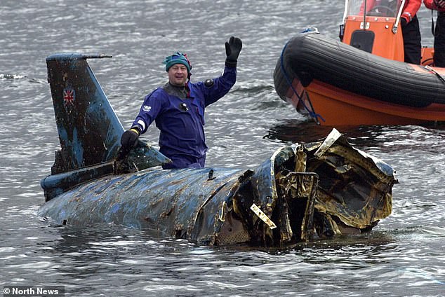 The hull - and Campbell's body - were left beneath the surface of Coniston Water for decades until both were recovered in 2001 (pictured: Bill Smith, who led the restoration before controversially seeking to claim part-ownership)