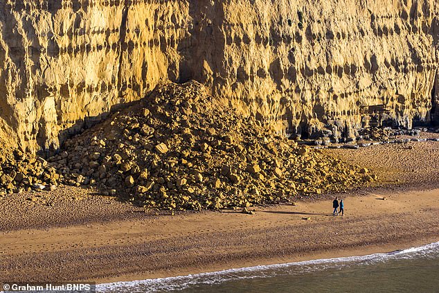 Witnesses reported hearing loud cracks in the cliff face seconds before it gave way, giving them enough time to run for safety