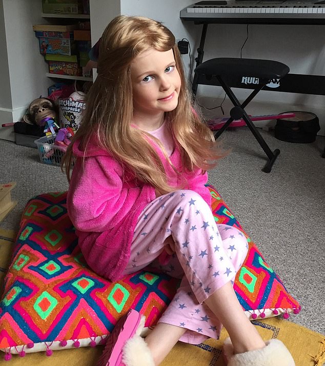 Seren pictured wearing the wig of real hair she received from The Little Princess Trust
