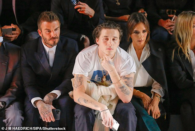 Brooklyn has been at the centre of a feud with the Beckham family that has pitted the influencer and his wife Nicola against his parents and brothers (Brooklyn, David and Victoria in 2020)