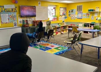 Children watch a television at the ABC Learning Center in Minneapolis, Minnesota, on Dec. 31, 2025.