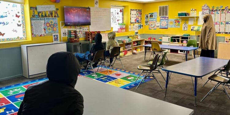 Children watch a television at the ABC Learning Center in Minneapolis, Minnesota, on Dec. 31, 2025.