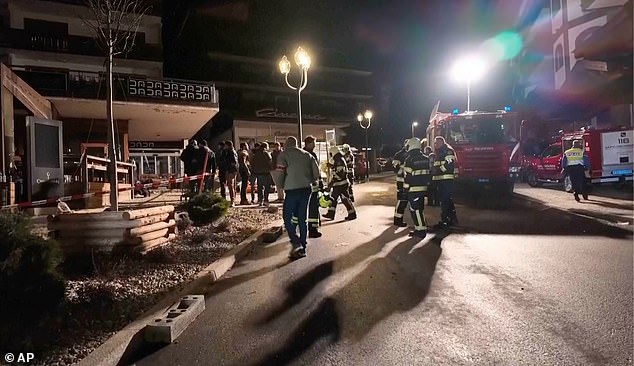 Rescue staffers and firefighters in the area where the fire broke out in Crans-Montana, Swiss Alps, Switzerland, Thursday, January 1, 2026