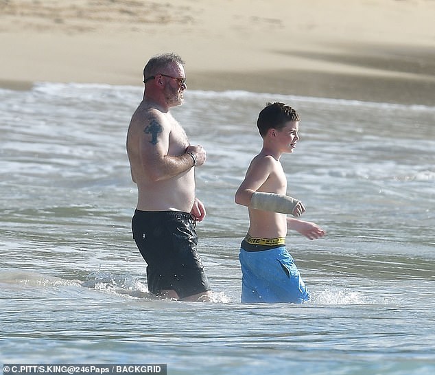The former footballer was in the water with Klay, who sported an arm cast