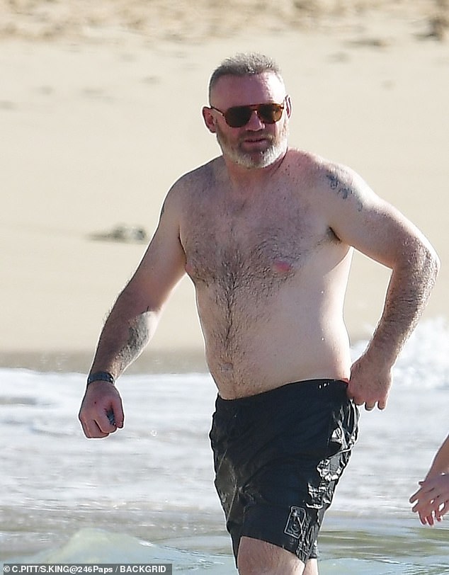 Wayne looked thoroughly relaxed as he soaked up the sun