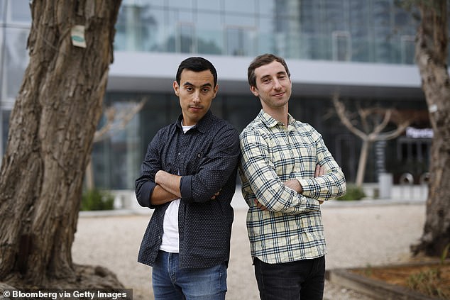 Igor, left, and Dmitri Bukhman, founders of Playrix Holding Ltd., pose for a photograph at Sarona Market in Tel Aviv, Israel, on Friday, March 29, 2019
