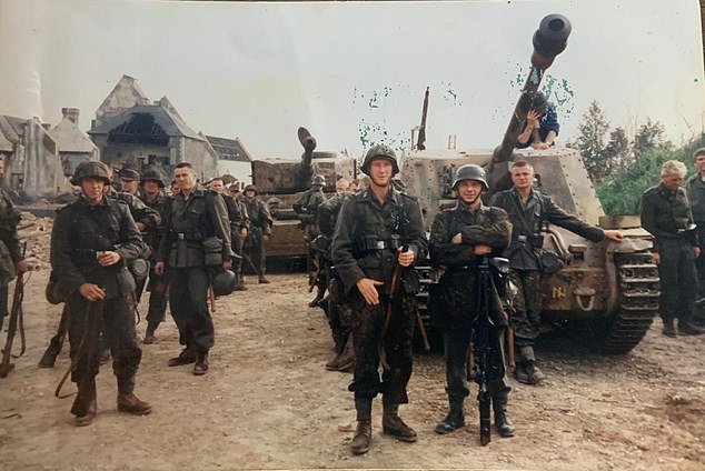 Mike standing with his arms folded, front right, just before filming the final battle of the film