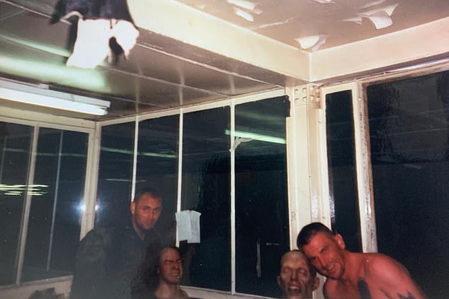 Extras posing with false heads that were blown up for special effects