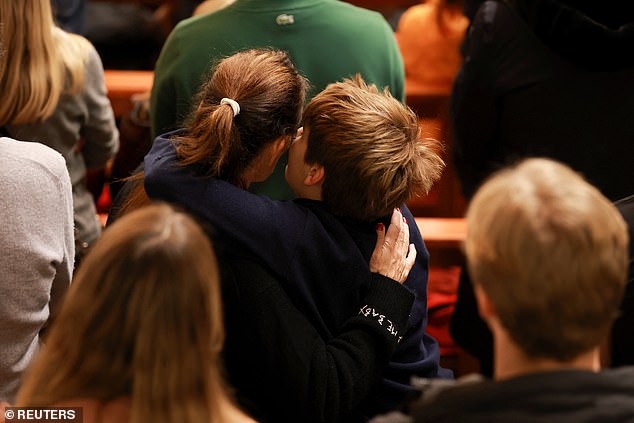 People attend a vigil at a church after a fire and explosion at the "Le Constellation" bar during a New Year's Eve party, where several people died and others were injured, according to Swiss police, in the upscale ski resort of Crans-Montana in southwestern Switzerland, January 1, 2026
