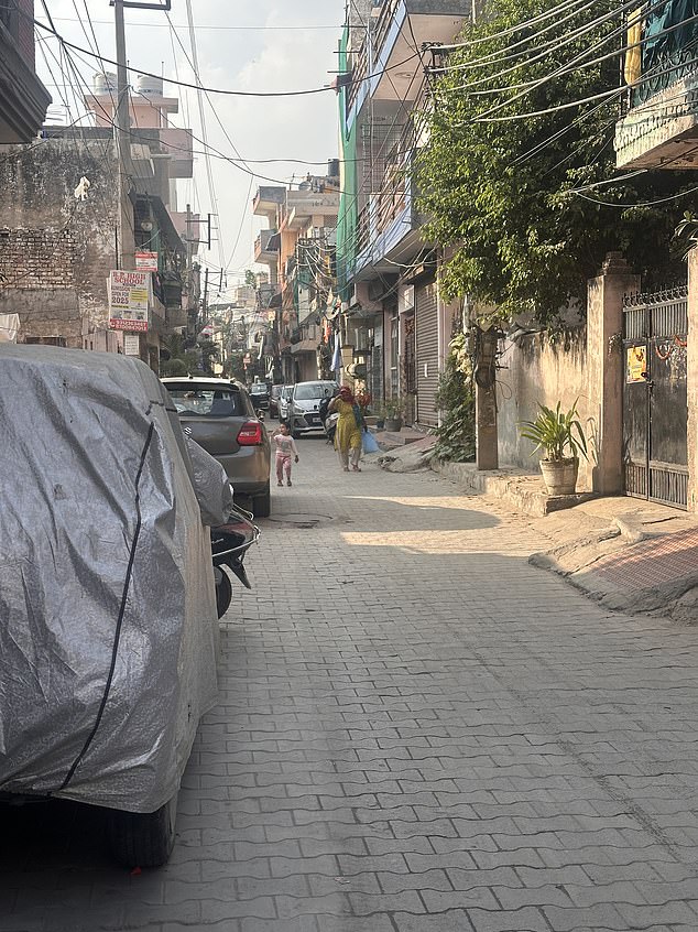 Locals say he rented a cramped one-bedroom unit with a shared toilet in a busy building, moving in with his girlfriend and her daughter