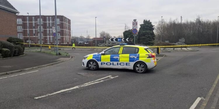 Man, 48, killed and woman, 50, fighting for her life after crashing into roundabout & veering off road on New Year's Eve