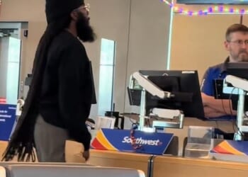 An irate passenger was caught on camera threatening a Southwest employee at Kansas City International Airport on Monday
