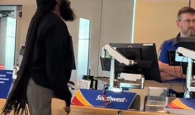 An irate passenger was caught on camera threatening a Southwest employee at Kansas City International Airport on Monday