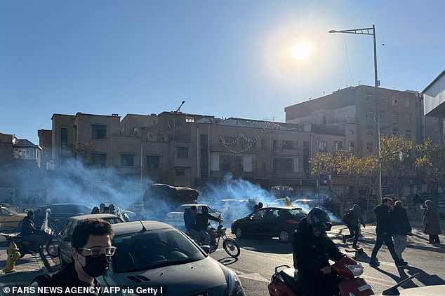 Iran's biggest ⁠protests in three years over ⁠economic hardship have turned violent across several provinces, ‍leaving multiple people ⁠dead. Pictured: Shopkeepers and traders protest in the street against the economic conditions and Iran's embattled currency in Tehran on December 29, 2025