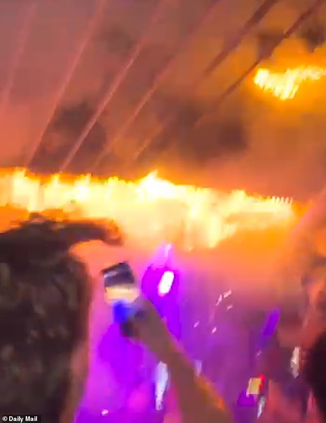 In the video footage ome can be seen trying desperately to extinguish the fire, but within seconds it takes hold, erupting into a deadly fireball that engulfs the packed bar