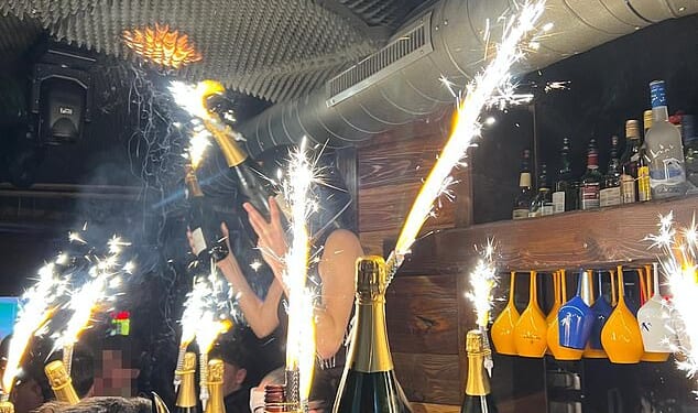 Images show the moment before a deadly New Year's Eve blaze a Swiss ski resort bar killed 47 people. A waitress had been seen dancing and waving a lit sparkler beneath foam soundproofing panels on the ceiling, which then caught light