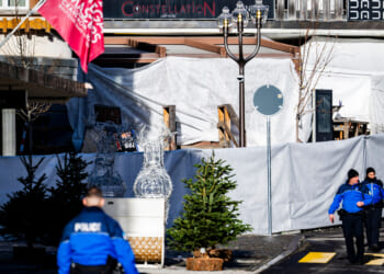 Police officers inspect the area where a fire broke out at the Le Constellation bar and lounge leaving people dead and injured, during New Year’s celebration, in Crans-Montana, Swiss Alps, Switzerland, on Jan. 1, 2026.
