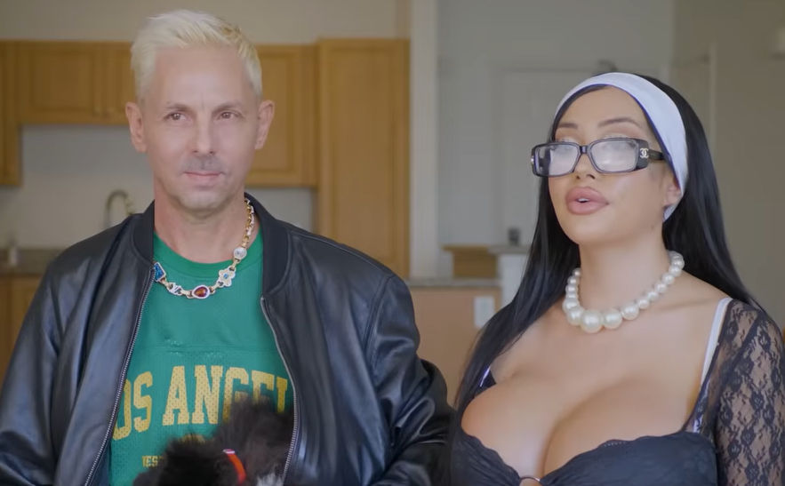 A man and a woman in an indoor setting.