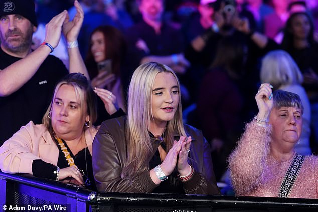 As well as his girlfriend, Littler's dad Anthony Buckley and his mum Lisa Littler (left) were there