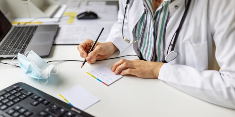 GPs hand out 40,000 'fit notes' every day as critics blast 'conveyor belt to worklessness'