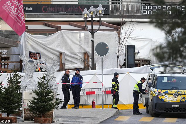 Security stands in front of the sealed off Le Constellation bar, where a devastating fire left dead and injured during the New Year's celebrations in Crans-Montana, Swiss Alps, Switzerland, Friday morning, Jan. 2, 2026