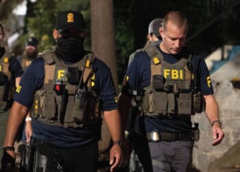FBI agents walk down Florida Avenue on Aug. 13, 2025 as part of President Donald Trump's deployment of federal officers and the National Guard in Washington, DC.