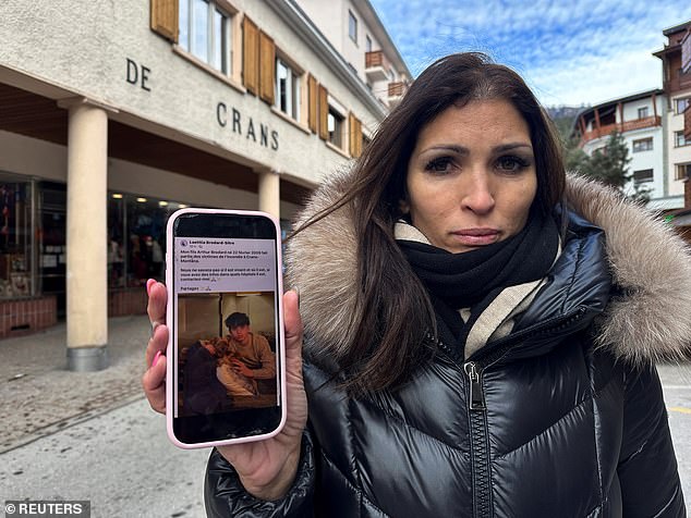 Laetitia Brodard-Sitre showing a photo of her 16-year-old son, Arthur, who is missing after the fire