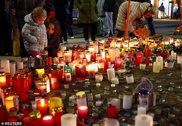 Candles have been laid at a makeshift memorial near the club