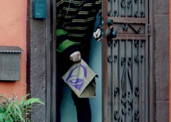 A bald Mickey Rourke looked unrecognizable as he emerged from the LA home he is potentially facing eviction from after allegedly failing to pay nearly $60,000 in rent