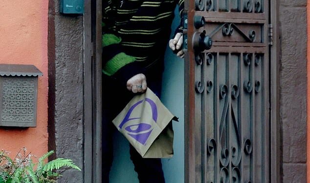 A bald Mickey Rourke looked unrecognizable as he emerged from the LA home he is potentially facing eviction from after allegedly failing to pay nearly $60,000 in rent