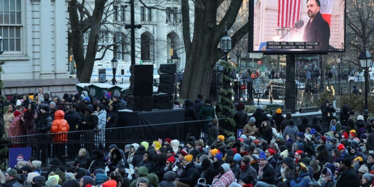 New York mayor Zohran Mamdani is seen on a screen as he speaks during his public inauguration ceremony followed by a block party at City Hall in New York on January 1, 2026.