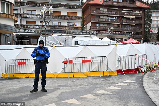 A policeman stands in front of the cordoned-off venue on Friday