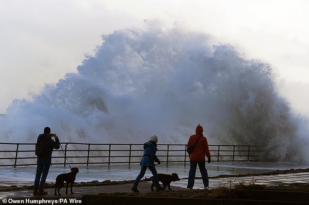 Waves crash against the sea wall in Whitley Bay, North Tyneside, amid weather warnings