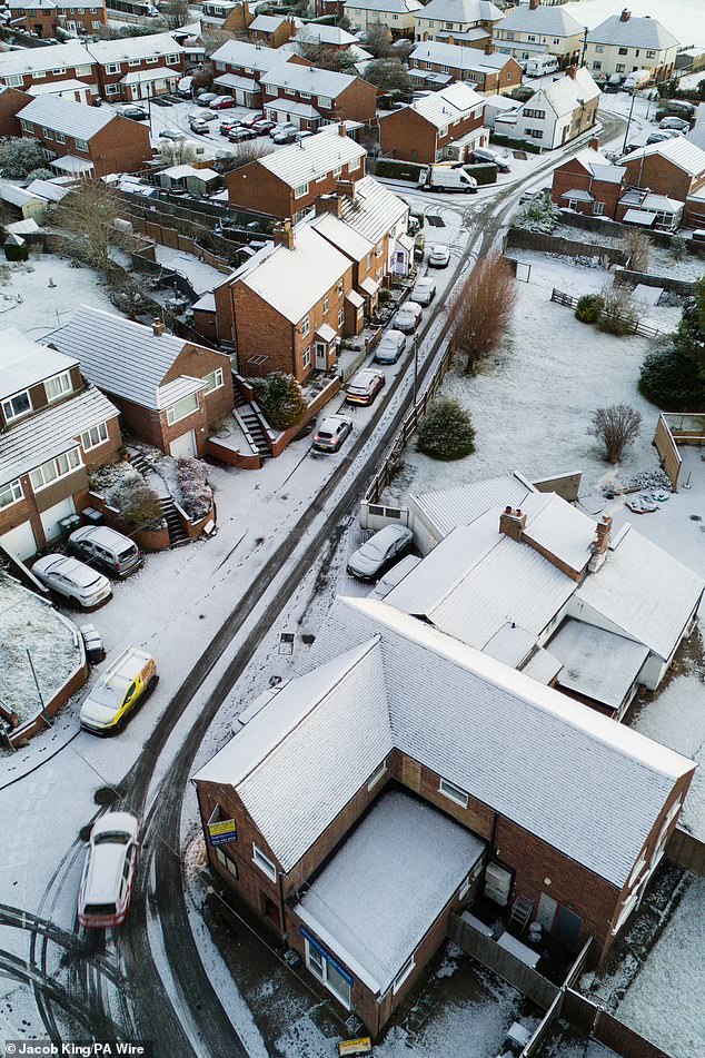 Snow-covered houses in the village of Bishop's Itchington in Warwickshire on Friday morning