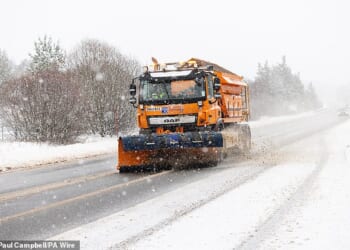 A Gritter lorry on the A9, south of Inverness, attempts to tackle the piling snow on the road