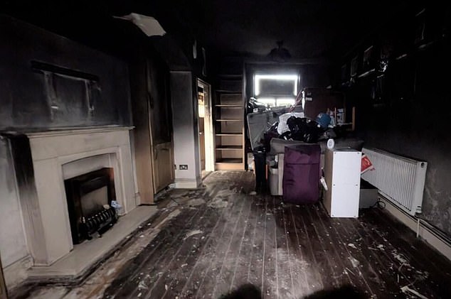 The charred remains of the living room (pictured)