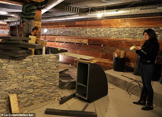 Mr and Mrs Moretti can be seen standing inside the basement of the bar as it undergoes renovation works in 2015