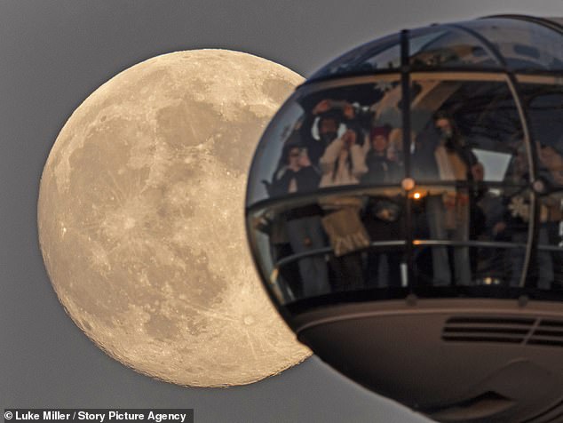 Last night, sightseers on the LondonEye gathered to capture a picture of the capital's full moon